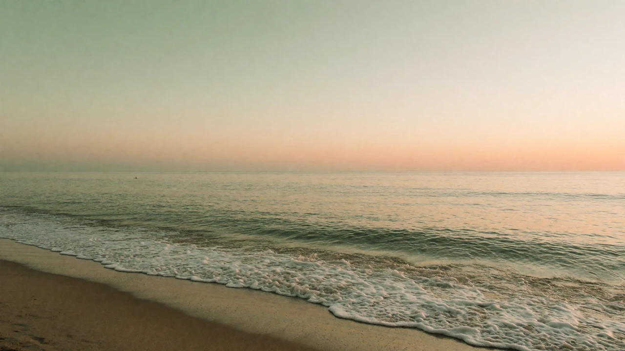A calm beach at sunrise with soft pastel skies, representing peace and grounding for anxiety and dating